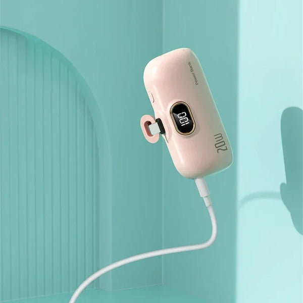 Pink electronic device with digital display on a light blue background
