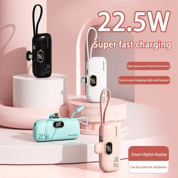 Four portable power banks with digital displays on a pink background