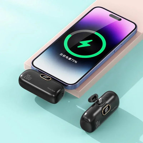 Phone with black wireless charging pad on a light blue background